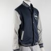 A navy varsity jacket with grey sleeves featuring the NU Lakers logo on the upper front left chest