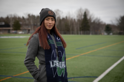 Student wearing a blue and green Lakers scarf