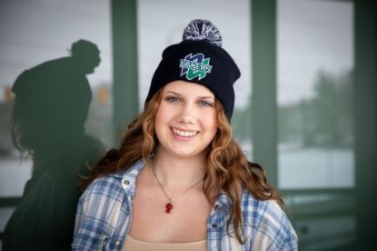 Student wearing the navy blue toque with the Nipissing Lakers logo on the front