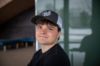 Student wearing a hat with the Nipissing Lakers logo on the front