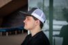 Student wearing a hat with the Nipissing Lakers logo on the front