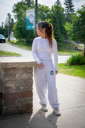 Student wearing grey track pants with the Lakers logo on the front right side