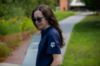 Student wearing an alumni Golf Polo with the Alumni logo on the left arm sleeve