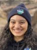 Student smiling at the camera wearing a navy Lakers beanie