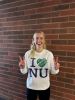 Student wearing a white long-sleeved "I HEART NU" Tee